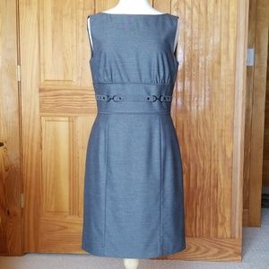 Sleeveless dress, close fitted with waist detail.